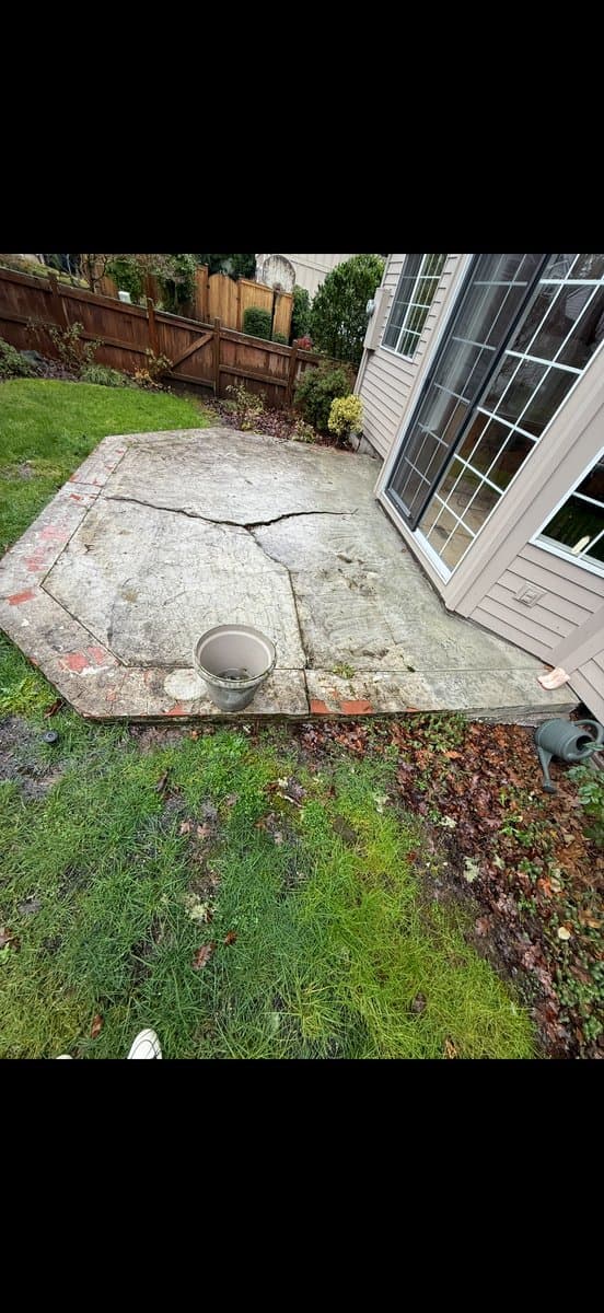 Old cracked patio before demolition